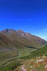 Fototapeta premium Ninth stage of Ak-Suu Traverse trek from Karakol Gorge to Jeti Oguz in Karakol national park, Kyrgyzstan