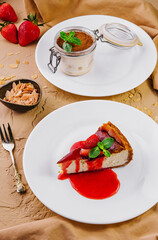 cheesecake with strawberry jam and tiramisu in a glass jar