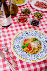Italian pasta with tomatoes, parmesan, basil and white wine