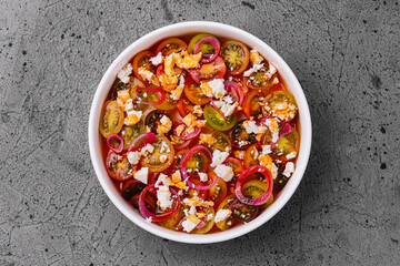 salad with cherry tomatoes and goat cheese