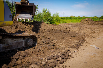 Excavator is digging on the construction site.