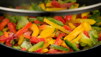 Frozen colorful bell pepper, ready for cooking. Cooking healthy vegan food