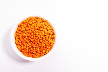 red lentils in a white plate on a white background
