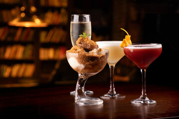 pairing sweet dessert with cocktails and alcoholic drinks on blurred background