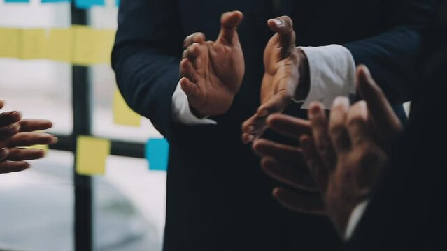 Photo of partners clapping hands after business seminar. Professional education, work meeting, presentation or coaching concept.Horizontal,blurred background