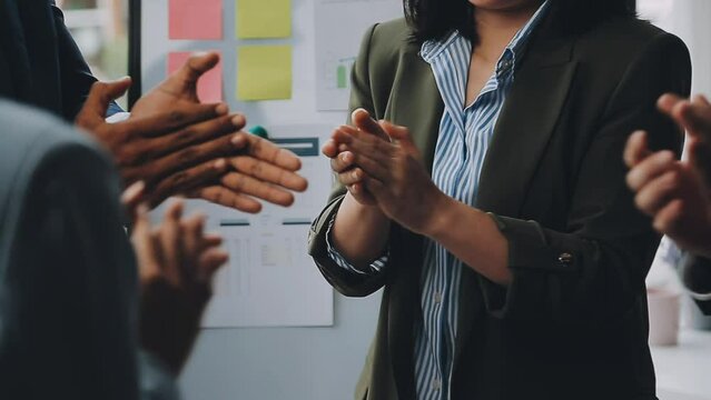 Photo of partners clapping hands after business seminar. Professional education, work meeting, presentation or coaching concept.Horizontal,blurred background