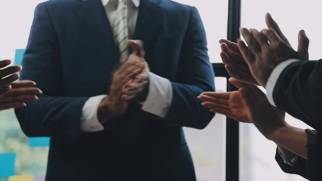 Photo of partners clapping hands after business seminar. Professional education, work meeting, presentation or coaching concept.Horizontal,blurred background