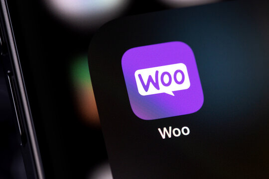 WooCommerce (Woo) icon mobile app on a screen smartphone iPhone. WooCommerce is an open-source e-commerce plugin for WordPress. Batumi, Georgia - November 4, 2023