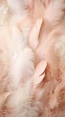A harmonious blend of feather textures in shades of blush, cream and taupe in artistic arrangement. Vertically oriented. 