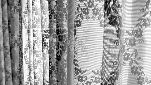 Black and white background image of a tulle curtain