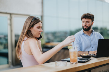 Young business couple discussing growth strategies in an urban cafe. They plan for market expansion and profitability, working efficiently and remotely.