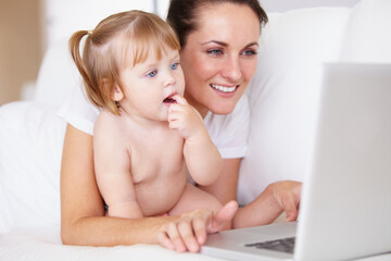 Family, laptop for remote work with a mother and baby in the bedroom of a home together to...