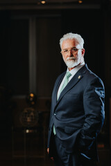 Experienced university rector poses in a prestigious academic classroom, embodying confidence and success.