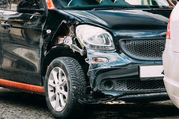 Broken Scratched And Dent Bumper Fender on small luxury Car after Collision. Scratched With Deep...