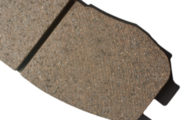 close-up top view of car disc brake pad surface, crucial components of vehicle braking system, made of friction materials that grip the brake disc or rotor isolated on white background