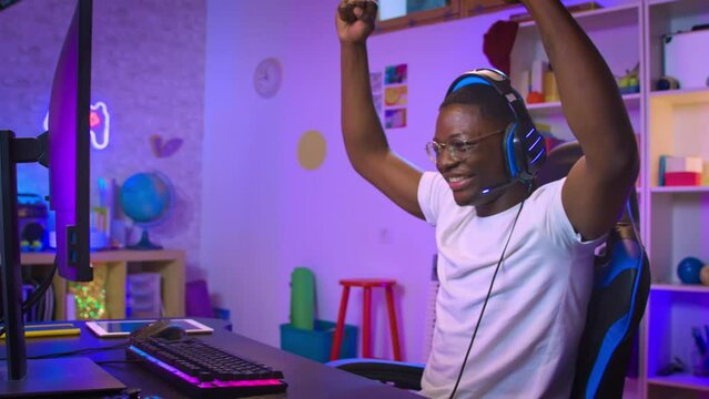 Professional Gamer winning and celebrating victory Online Video Game on Computer. High quality photo