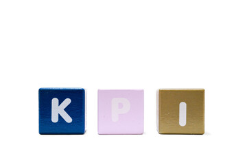 text KPI Key Performance Indicator on colorful wooden isolated on a white