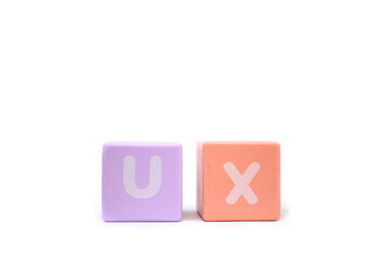 text UX User Experience on colorful wooden isolated on a white background