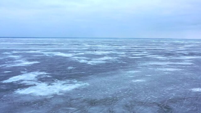 Lake , girl walking on frozen lake, Girl walking on cracked ice of a frozen lake Baikal, Woman walking along the diamond beach in Iceland. Feet on ice, girl walking on frozen lake 