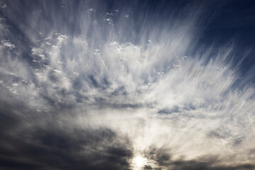 Scenic view of blue sky with cirrus clouds during sunset. Textured background of beautiful clouds at sunset.
