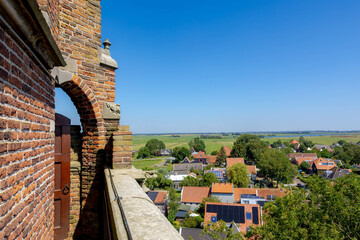 Typical Dutch polder in summer, Canal or ditch and green meadow, Overview from the top of Church...