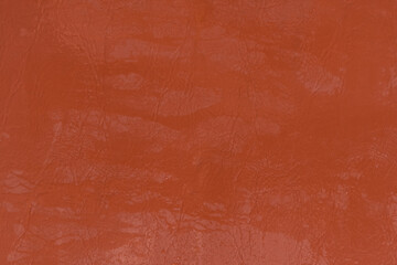 Wet water surface of orange brown leather streaks background texture backdrop