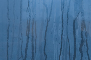 Blue streaks paint spilled surface ceramic tiles wall dirty old texture background, close-up