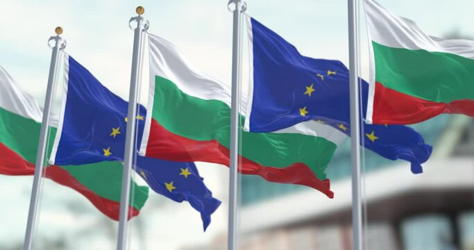 Flags of Bulgaria and the European Union waving in the wind on a clear day