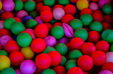 Colored plastic balls in pool of game room.