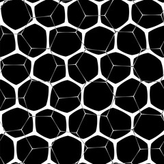 A seamless abstract pattern in bold black and white featuring a honeycomb motif on a black with a mesh-like design