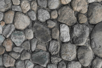 Stones grey cobblestones cement wall solid texture background rough street gray
