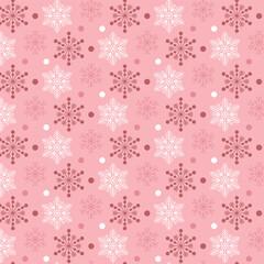 Snowflakes on a pink background. Seamless pink pattern with snowflakes.