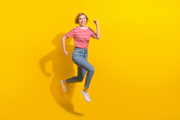 Fototapeta na wymiar Full size profile photo of energetic overjoyed girl jump rush empty space isolated on yellow color background