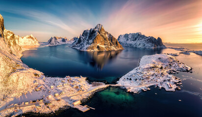 Colorful sunrise over Lofoten Islands and traditional norwegian fishing village in winter at Norway - obrazy, fototapety, plakaty