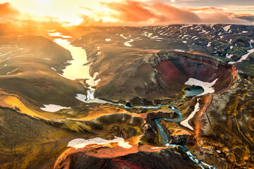 Dramatic landscape of sunset shines over volcanic mountain in Icelandic Highlands on summer at...