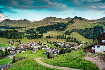 Mountain village of Stoos surrounded by Swiss Alps, in summer at Schwyz, Switzerland - obrazy, fototapety, plakaty