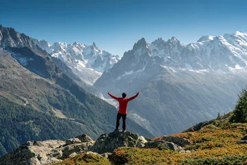 Keuken foto achterwand Mont Blanc A male hiker standing with enjoying the Mont Blanc mountain range view during trail in Lac Blanc at France