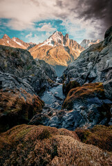 French alps mountain with stream flowing in rocky valley at Chamonix, France