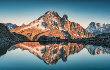 French alps landscape of Lac Blanc with Mont Blanc mountain range reflected on lake in the sunset at Chamonix, France