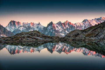 Lac Blanc with Mont Blanc mountain range reflect on the lake in French Alps at the sunset....
