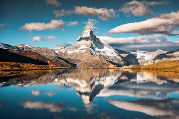 Matterhorn mountain reflected on Lake Stellisee in the morning at Zermatt, Switzerland - obrazy, fototapety, plakaty