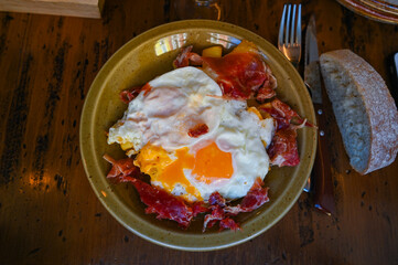 A delicious home style breakfast with crispy bacon and eggs, Madrid, Spain, High quality photo