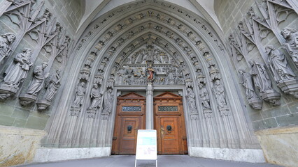 Fribourg, Switzerland Circa March 2022 - Entrance of Ancient Traditional Saint Nicholas Cathedral, Religious doorway - obrazy, fototapety, plakaty