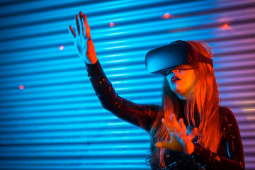 Blonde woman gesturing using Virtual reality goggles