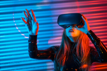 Woman using Virtual reality goggles in a futuristic space