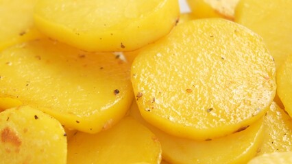 Close-Up Dolly shot of Baking Golden Potatoes.