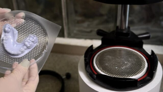 Mouth guard for teeth, printed on a 3D printer in dental clinic laboratory. 4k cinematic slow motion video