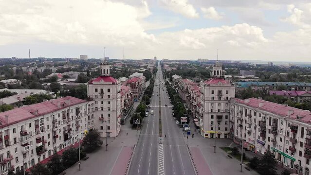 View from a drone along Soborniy Avenue (the main street) in Zaporizhzhia, Ukraine. The camera is being raised, revealing more and more of the cityscape
