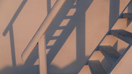 Staircase with shadow. Sunset. Cosmetic background. Empty stand with geometric shape on pastel...