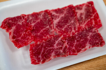 Close-up of rare meat, prepared for barbecue grill with soft focus